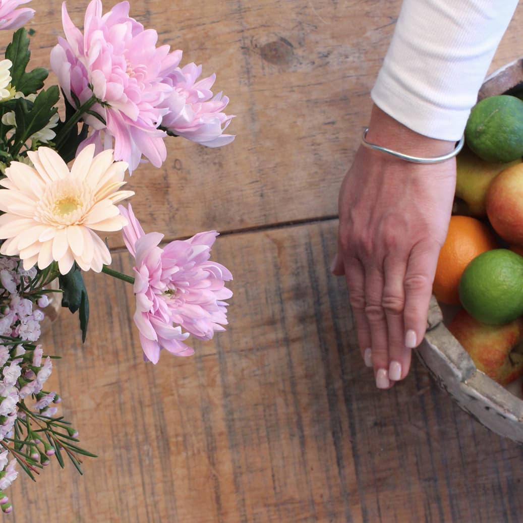 Avoid keeping the flowers in full sun, near heat or a fruit bowl.